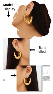 Three-way view of 18k gold plated U-shaped earrings with irregular twisted texture on model