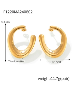 Detail view of large U-shaped irregular titanium steel earrings with 18k gold plating