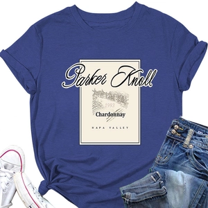 Flat lay of navy blue Parker Knoll 1993 wine print t-shirt with jeans and canvas shoes