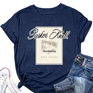 Detail of vintage Parker Knoll Chardonnay print on a navy blue short sleeve t-shirt