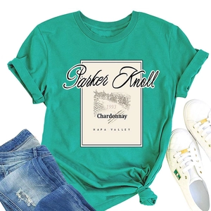 Close-up of vintage Parker Knoll 1993 print on a turquoise crew neck t-shirt with knotted hem