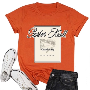 Detail of vintage Parker Knoll 1993 wine label print on an orange cotton T-shirt