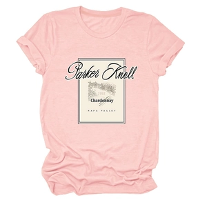 Detailed close-up of light pink t-shirt featuring vintage Parker Knoll wine label print