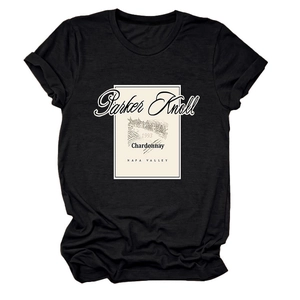 Detailed view of the vintage 1993 Parker Knoll Chardonnay print on a black cotton t-shirt