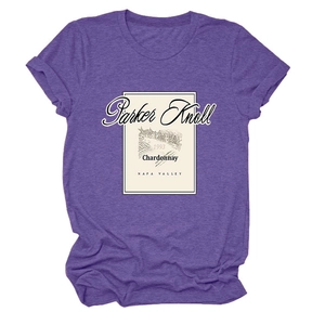 Detailed close-up of a purple crew neck t-shirt featuring a vintage wine label graphic print