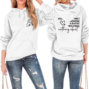 Front and back view of white hoodie with Be KIND print and large quote on the back