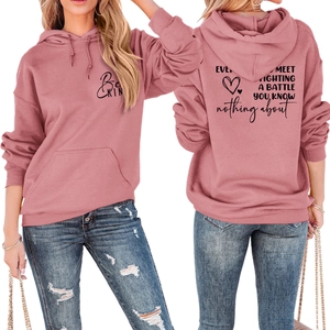 Front and back views of a mauve hoodie with Be Kind lettering and heart graphics