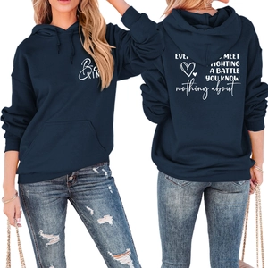 Detail of navy blue hoodie featuring 'Be KIND' text and back motivational heart print