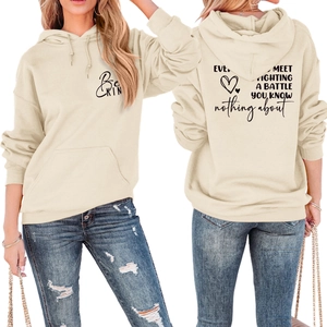 Detail of Be Kind print and back quote on a beige oversized drop shoulder hoodie