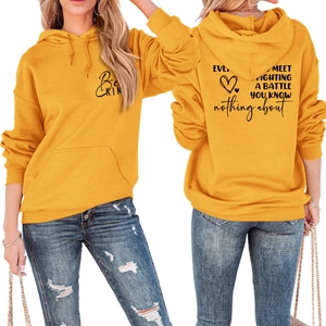 Front and back detail of yellow hoodie with Be Kind print and motivational quote
