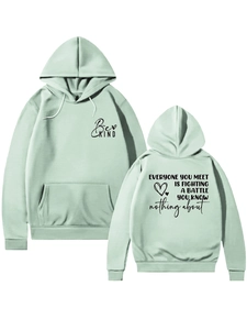 Detail of mint green hoodie with kangaroo pocket and Be Kind battle quote back print