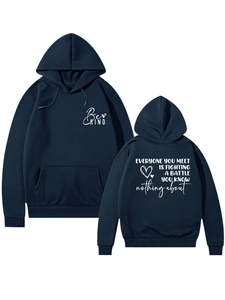 Detail of navy blue hoodie featuring Be Kind text and inspirational back quote print