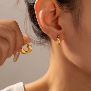 Polished 18k gold plated U-shaped hoop earrings for women with a smooth metallic finish