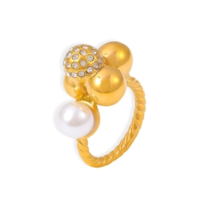 Anillo vintage de oro 18K con perla, textura trenzada y esferas de circón brillante