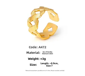 Detail of 18k gold plated titanium steel ring showing intricate woven hollow texture