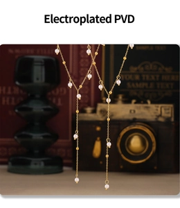 Detailed macro view of PVD plated gold necklace with pearls against a vintage background