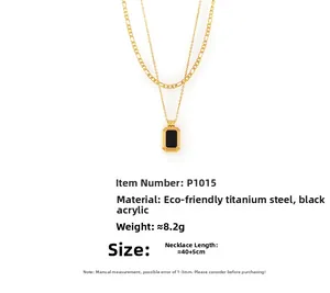 Detail of double-layer gold titanium steel necklace with black acrylic square pendant