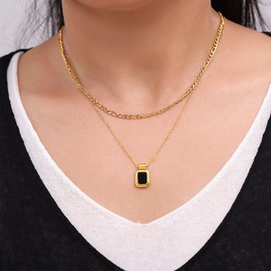 Double-layer gold plated titanium necklace with rectangular black pendant on model