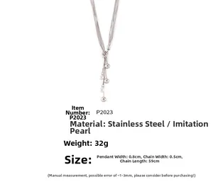 Detail of multi-strand stainless steel necklace with imitation pearls and OT buckle