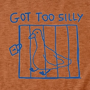 Detail of the Got Too Silly slogan and blue duck graphic on rust orange cotton fabric