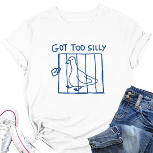 Flat lay of white cotton T-shirt featuring Got Too Silly duck print and blue denim shorts