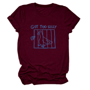 Detail of burgundy T-shirt showing Got Too Silly slogan and blue duck graphic print