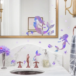 Detailed view of iridescent mermaid and star wall decals in a modern bathroom setting