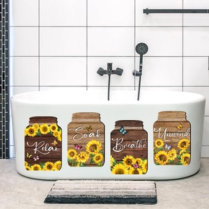 Détail de quatre autocollants de baignoire en forme de bocaux avec tournesols et Relax