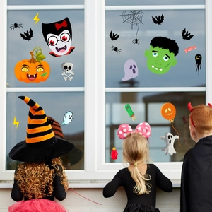 Halloween cartoon window stickers featuring pumpkins and ghosts shown on a white window frame
