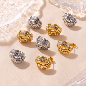 Twisted hollow knot earrings in gold and silver plating with pavé cubic zirconia