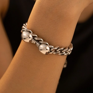 Polished stainless steel chunky curb chain bracelet featuring bold pebble link accents