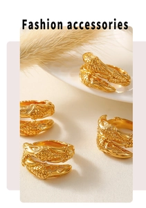 Detail of adjustable gold snake ring with realistic scale texture and metallic finish