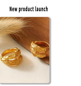 Detail of 18k gold plated stainless steel rings with unique dragon scale texture