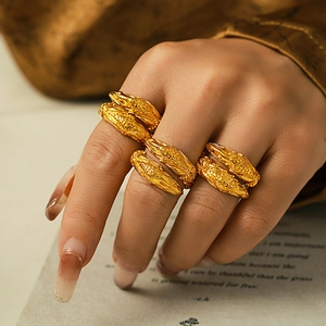 Set of four vintage 18k gold plated stainless steel open rings with textured engraving