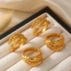 Set of four gold-plated stainless steel rings with eagle relief and hammered textures