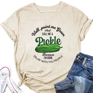 Detail of oatmeal crewneck t-shirt with funny green pickle graphic and text quote