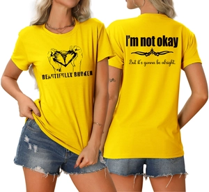 Détails avant et arrière du t-shirt jaune avec imprimés Beautifully Broken et texte