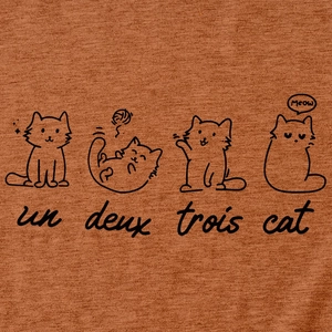 Detail of cute cat illustration and Meow text on caramel cotton knit t-shirt fabric