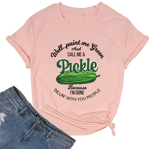 Detail of pink cotton T-shirt featuring funny green pickle print and stylish side knot