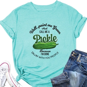 Detail of mint green T-shirt with pickles graphic and stylish knotted hem design