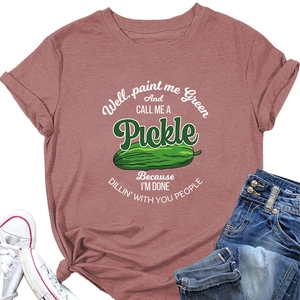 Detail view of cotton t-shirt featuring humorous green pickle print on dusty rose fabric