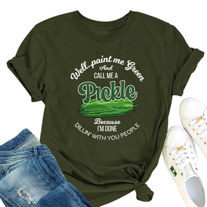 Flat lay of olive green cotton T-shirt with Pickle slogan and distressed blue jeans