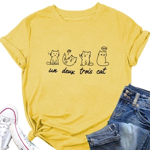 Detail of yellow cotton T-shirt featuring un deux trois cat print and knotted hem design