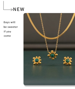 Detail view of sunflower jewelry set with colorful gemstones and gold plating