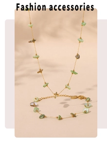 Detailed flat lay of French vintage gold chain jewelry set with green natural stone beads