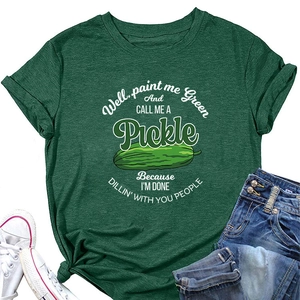 Detailed flat lay of dark green T-shirt with cartoon pickle print and funny quote