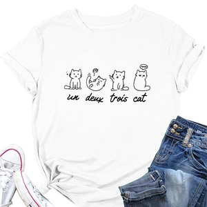 Flat lay of a white crew neck T-shirt with cat prints, knotted hem and denim jeans
