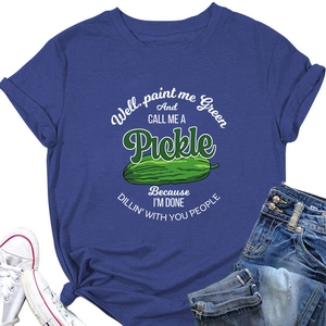 Flat lay of blue crew neck T-shirt with humorous pickle illustration and slogan