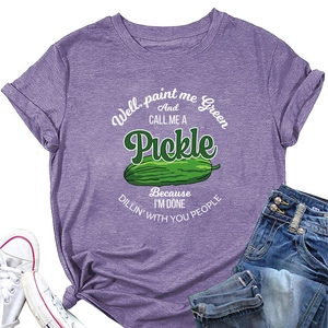 Detail view of purple crewneck T-shirt with pickle graphic and humorous text slogan