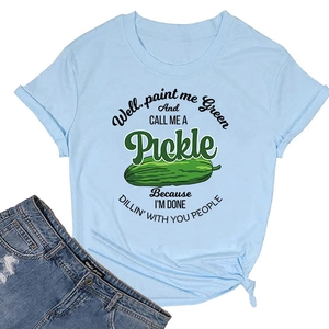 Detail of light blue t-shirt featuring rolled sleeves, side knot, and pickle print